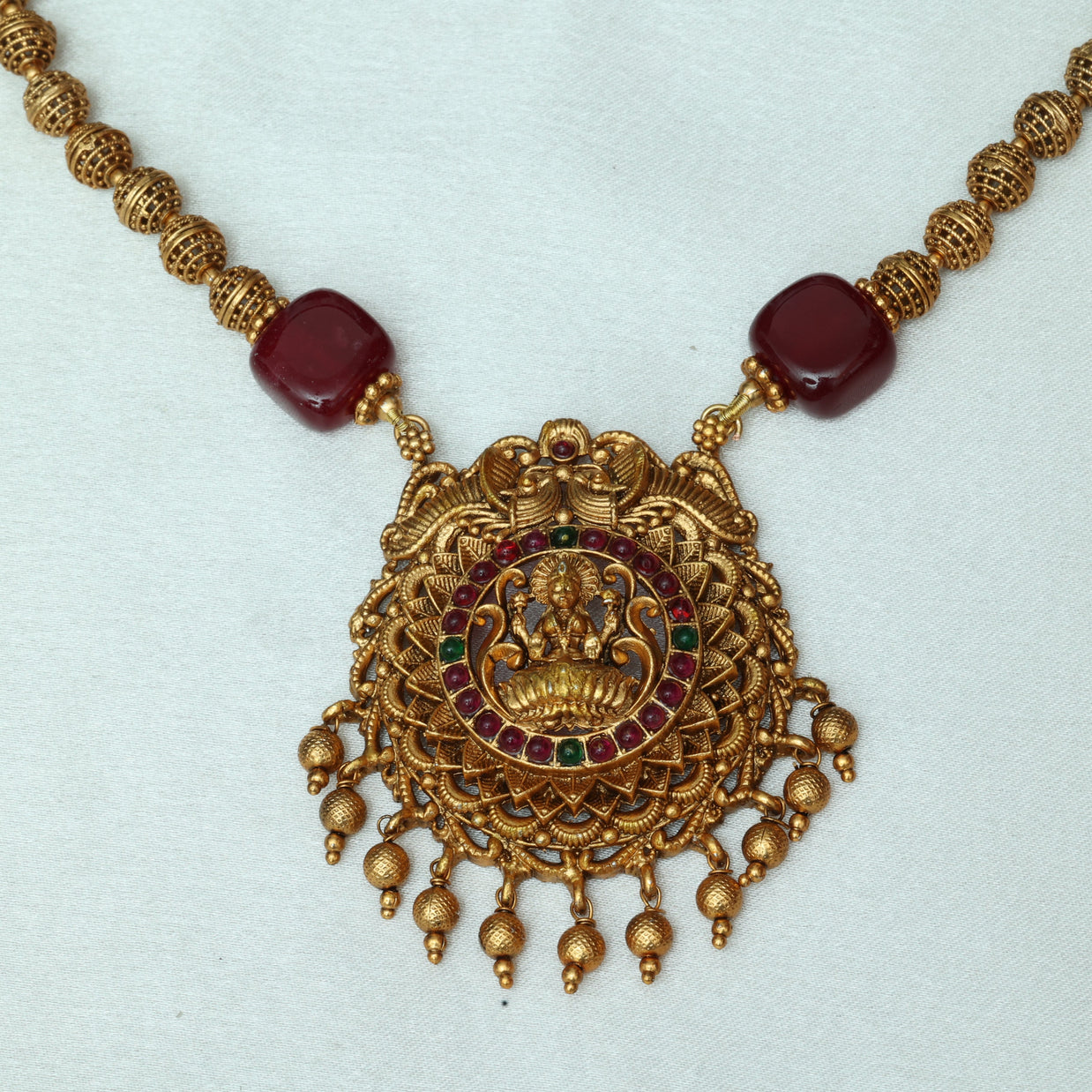 Antique Golden Beads Haaram With Stone Embedded Lakshmi Pendant